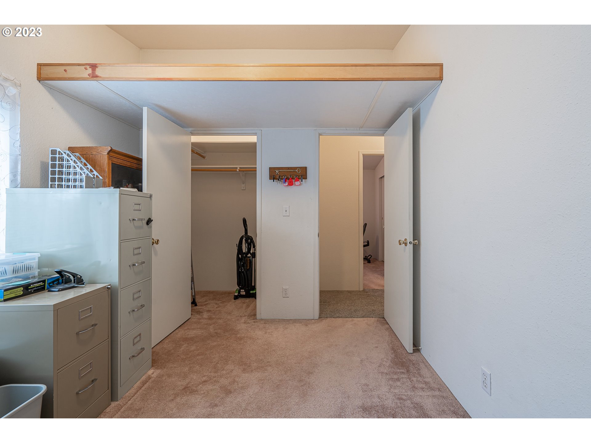 20840 Butteville Road Northeast Donald, OR 97020 - Photo 25 of 40 a view of hallway with walk in closet and wooden floor