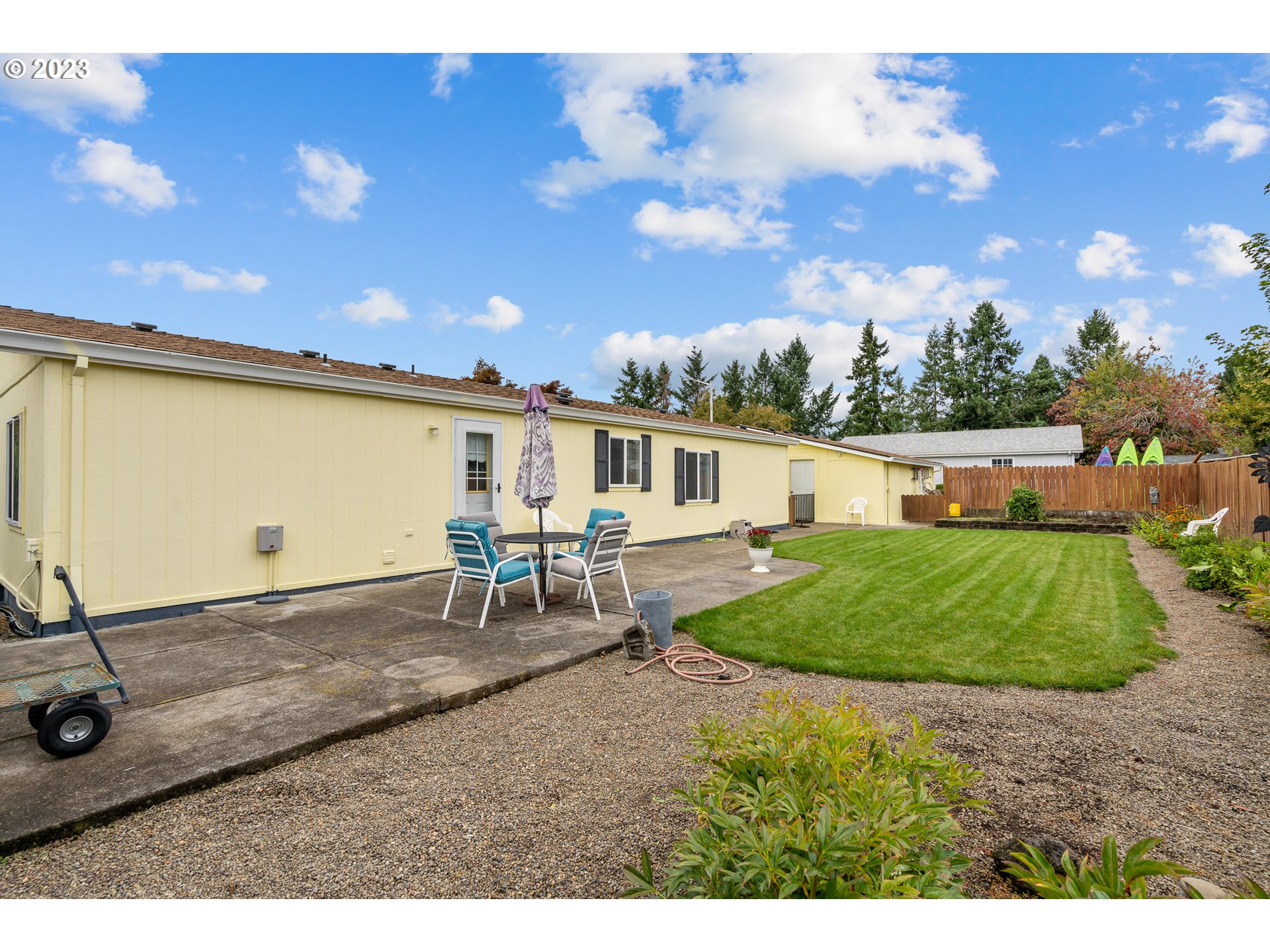 20840 Butteville Road Northeast Donald, OR 97020 - Photo 38 of 40 a backyard of a house with table and chairs