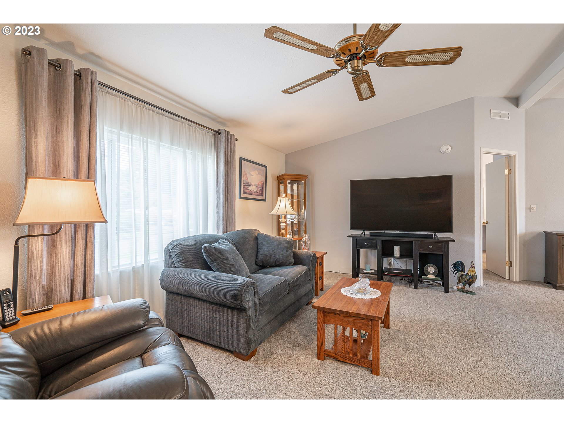 20840 Butteville Road Northeast Donald, OR 97020 - Photo 4 of 40 a living room with furniture and a flat screen tv