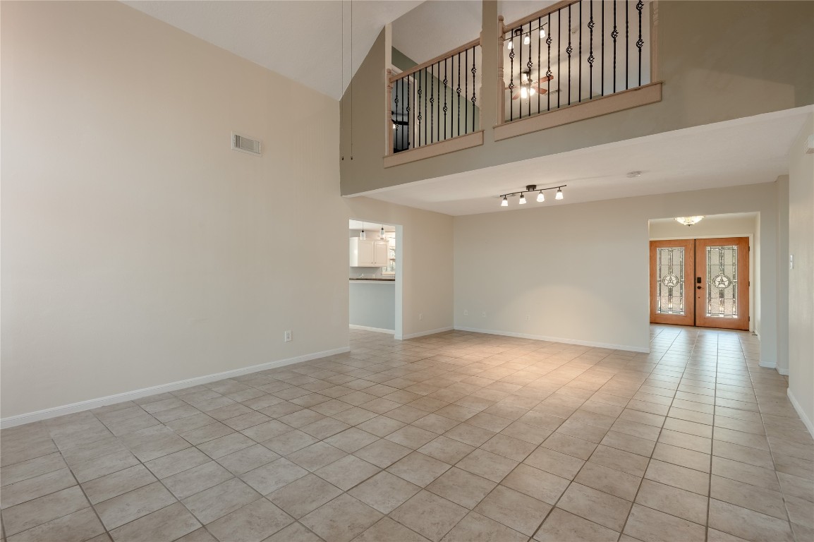 12 Quiet Wind Trinity, TX 75862 - Photo 12 of 48 Living room looking to the front door and the kitchen to the top left of the photo.