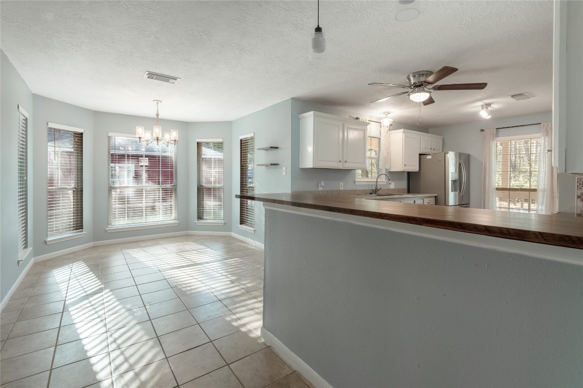 12 Quiet Wind Trinity, TX 75862 - Photo 14 of 48 This kitchen has a breakfast with bay windows and a breakfast bar.