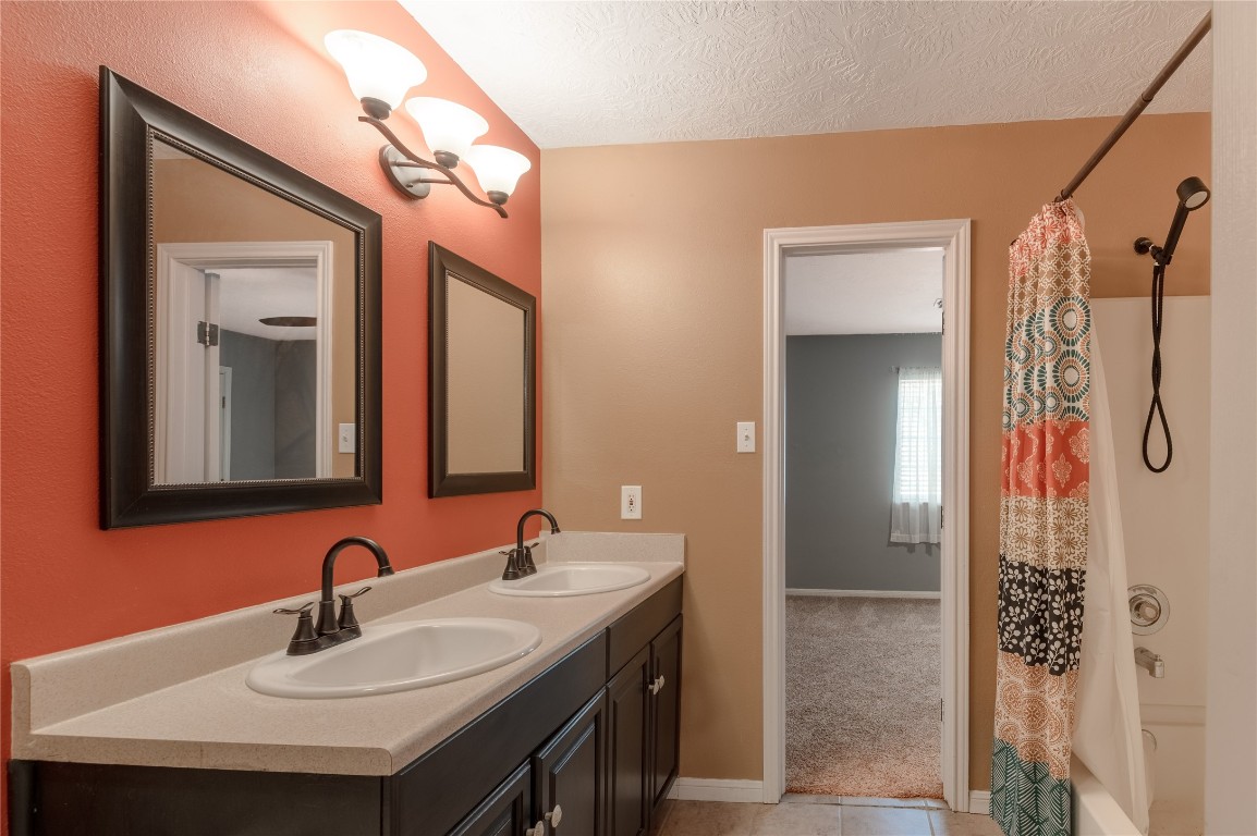 12 Quiet Wind Trinity, TX 75862 - Photo 31 of 48 This is bath room on the second floor. It has double sinks and a tub/ shower combo.