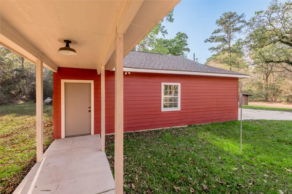a view of a brick house with a yard