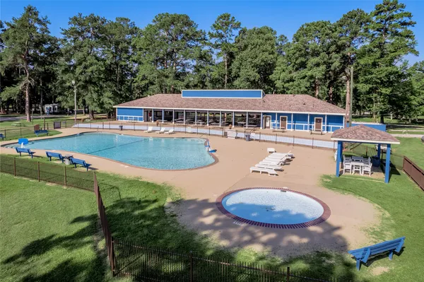an aerial view of a house with swimming pool garden and patio
