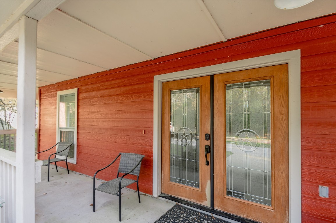 12 Quiet Wind Trinity, TX 75862 - Photo 5 of 48 The home has a wrap-around porch. All you need is a chair and your favorite beverage.