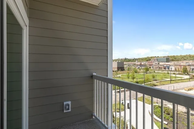 a view of a balcony with city view