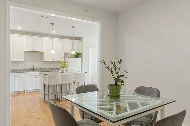 a kitchen with kitchen island granite countertop a white cabinets and counter space