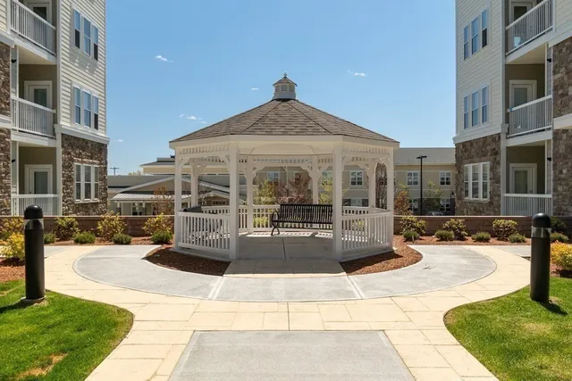 a view of a building with sitting area