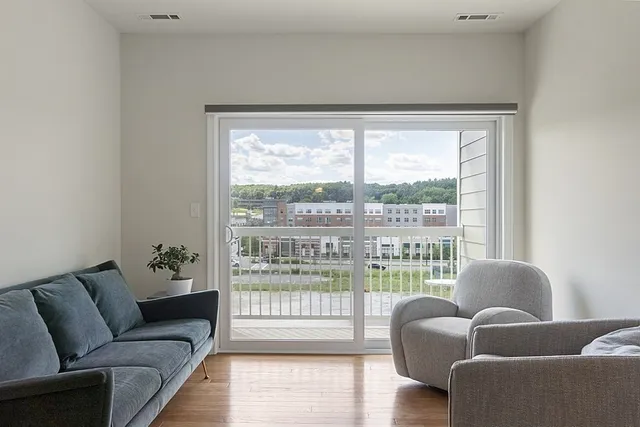 a living room with furniture and a large window