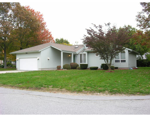 4 Abby Road Barrington, RI 02806 - Photo 1 of 12 a view of a yard in front of a house with large trees