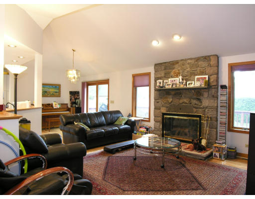 4 Abby Road Barrington, RI 02806 - Photo 3 of 12 a living room with furniture and a fireplace