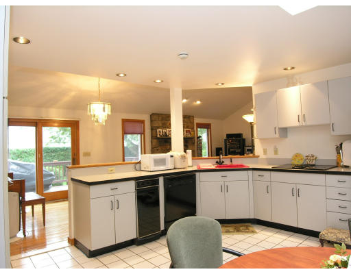 4 Abby Road Barrington, RI 02806 - Photo 4 of 12 a kitchen with a sink and cabinets