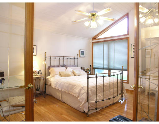 4 Abby Road Barrington, RI 02806 - Photo 8 of 12 a spacious bedroom with a bed a couch and a large window