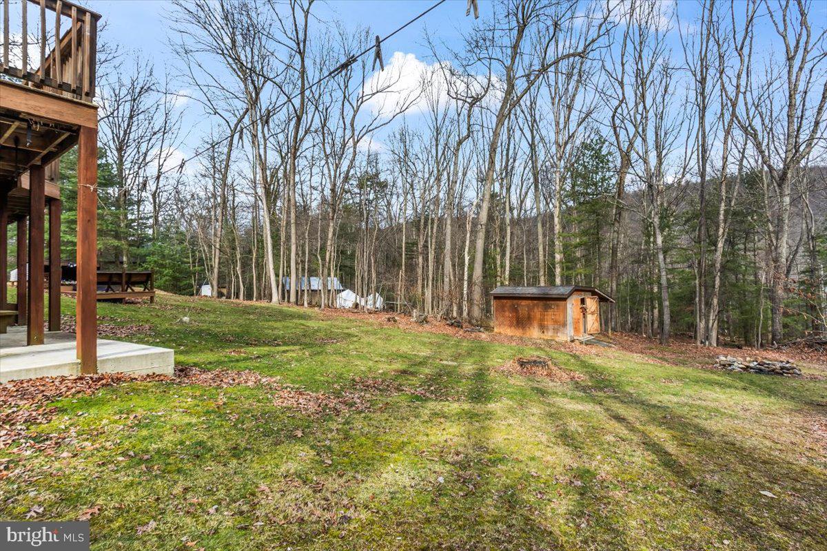 230 Laurel Run Road Dillsburg, PA 17019 - Photo 26 of 36 a backyard of a house with lots of green space and fountain