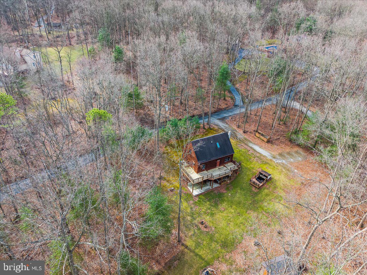 230 Laurel Run Road Dillsburg, PA 17019 - Photo 31 of 36 a view of a backyard with plants and a lake view