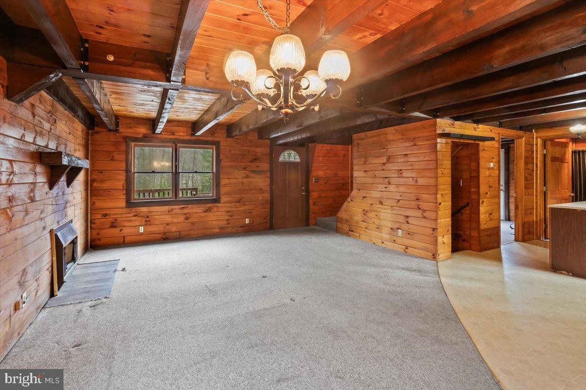 230 Laurel Run Road Dillsburg, PA 17019 - Photo 5 of 36 a view of an empty room with wooden walls