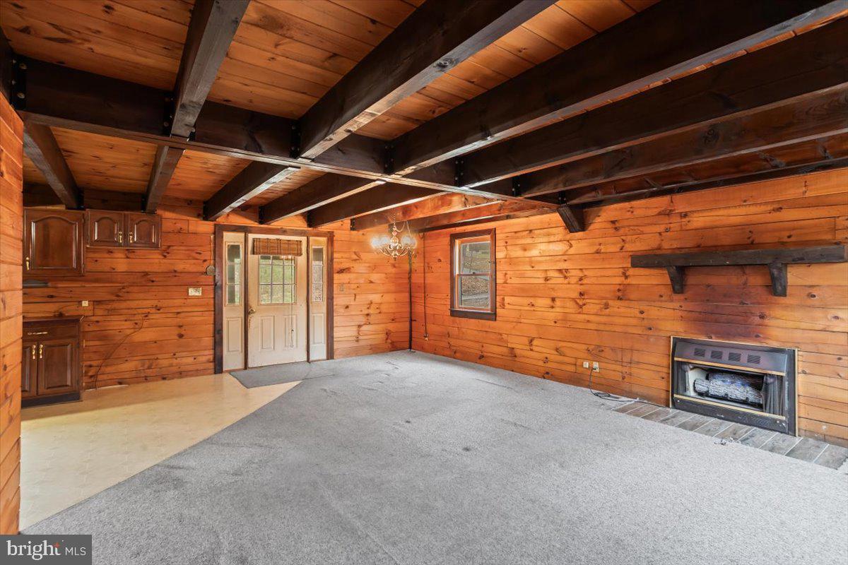 230 Laurel Run Road Dillsburg, PA 17019 - Photo 7 of 36 a view of an empty room with a fireplace