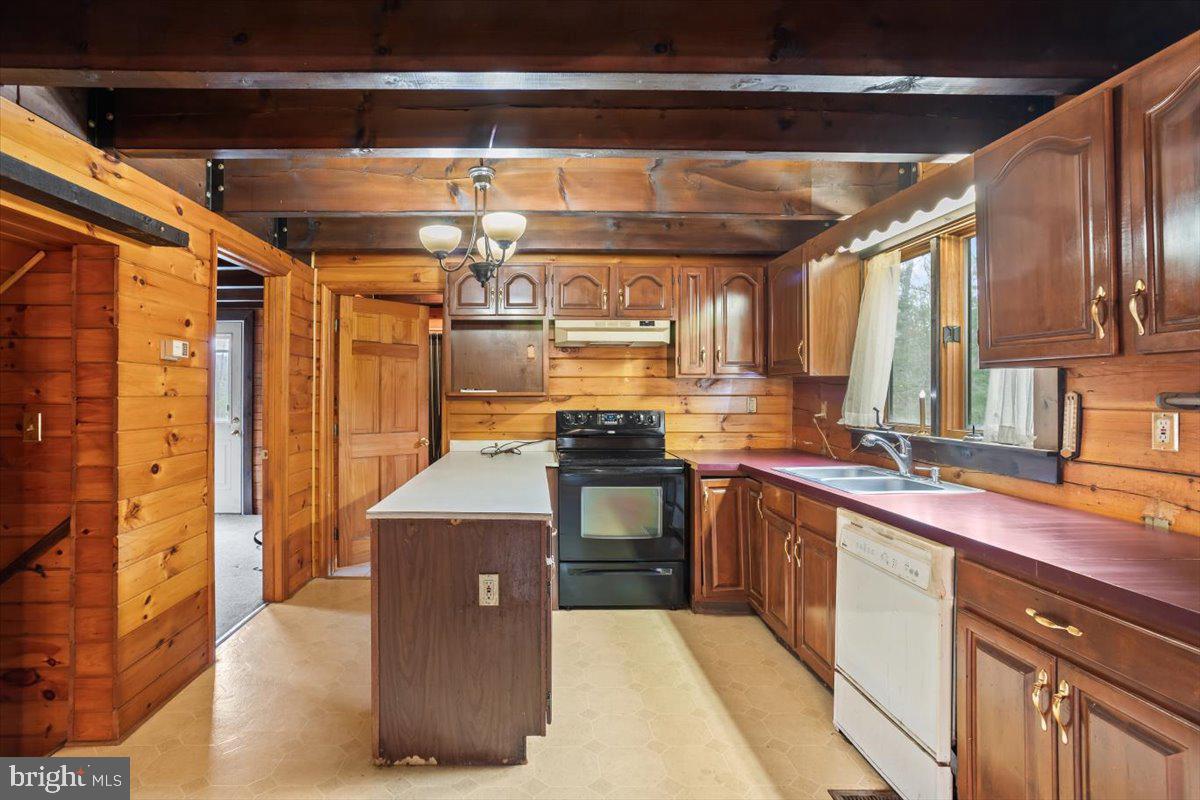 230 Laurel Run Road Dillsburg, PA 17019 - Photo 9 of 36 a kitchen with stainless steel appliances granite countertop a sink a stove and a refrigerator