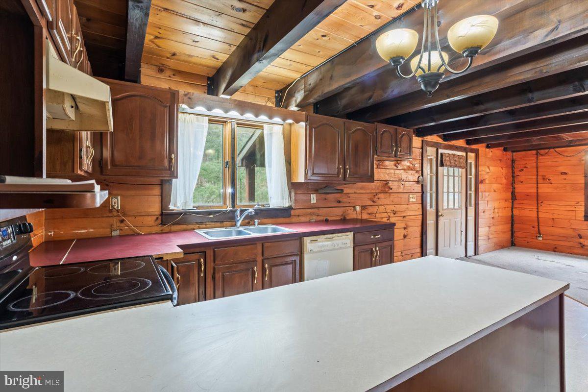 230 Laurel Run Road Dillsburg, PA 17019 - Photo 10 of 36 a kitchen with stainless steel appliances granite countertop a sink a stove and a microwave oven