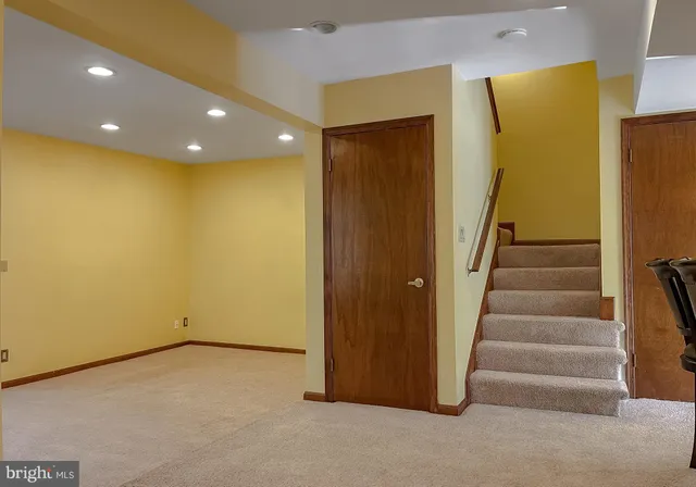 a view of an empty room with stairs