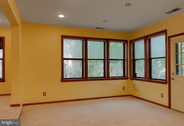 an empty room with windows