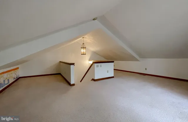 a view of an empty room with stairs