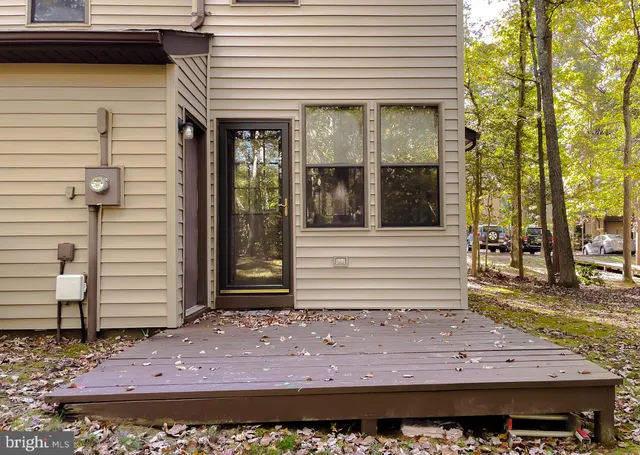 a view of a house with a yard and garage