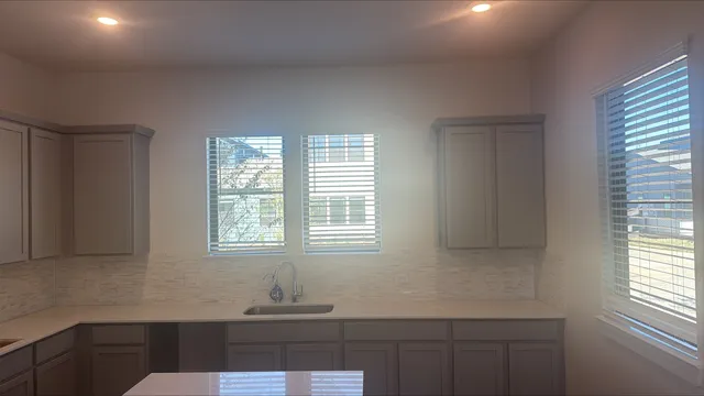 a room with wooden floor and window