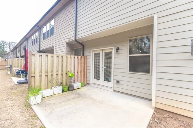 a view of a house with a backyard and a garage