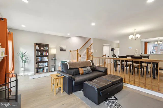a living room with furniture gym equipment and a large mirror
