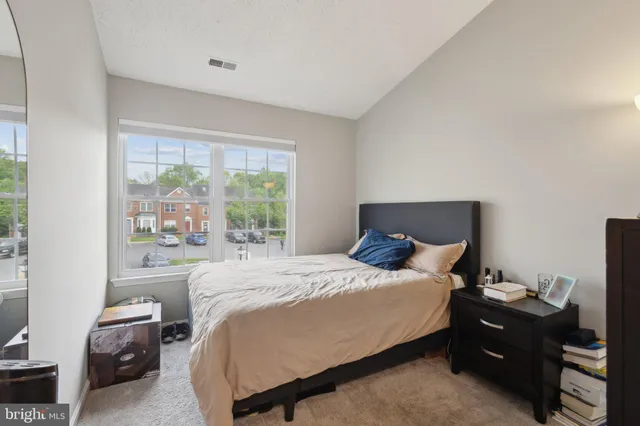 a bathroom with a bathtub a double vanity sink and mirror