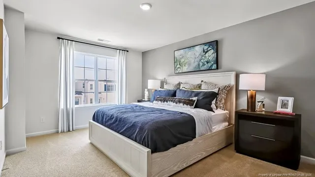 a bed room with a bed and a night stand