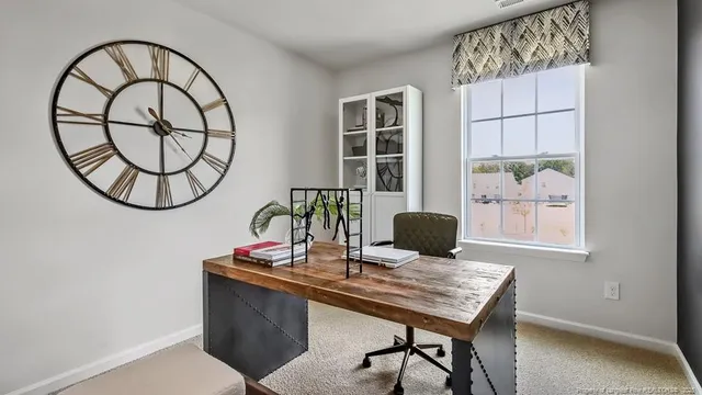 a view of a workspace with furniture