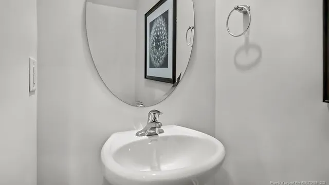 a bathroom with a sink and mirror