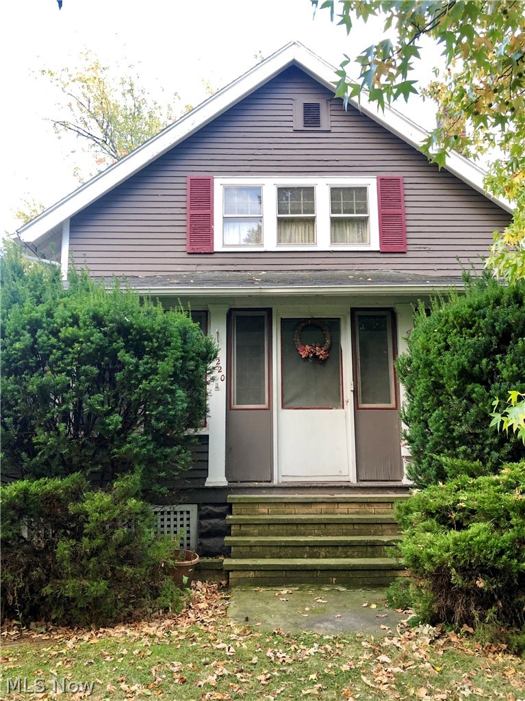 18220 Cornwall Road Cleveland, OH 44119 - Photo 1 of 22 Front exterior of the house with closed in front porch.