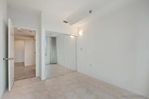an empty room with mirror in closet