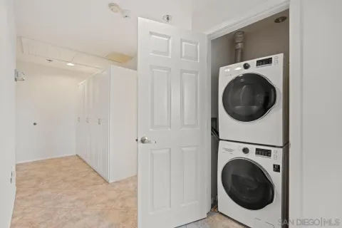 a view of a hallway with washer and dryer