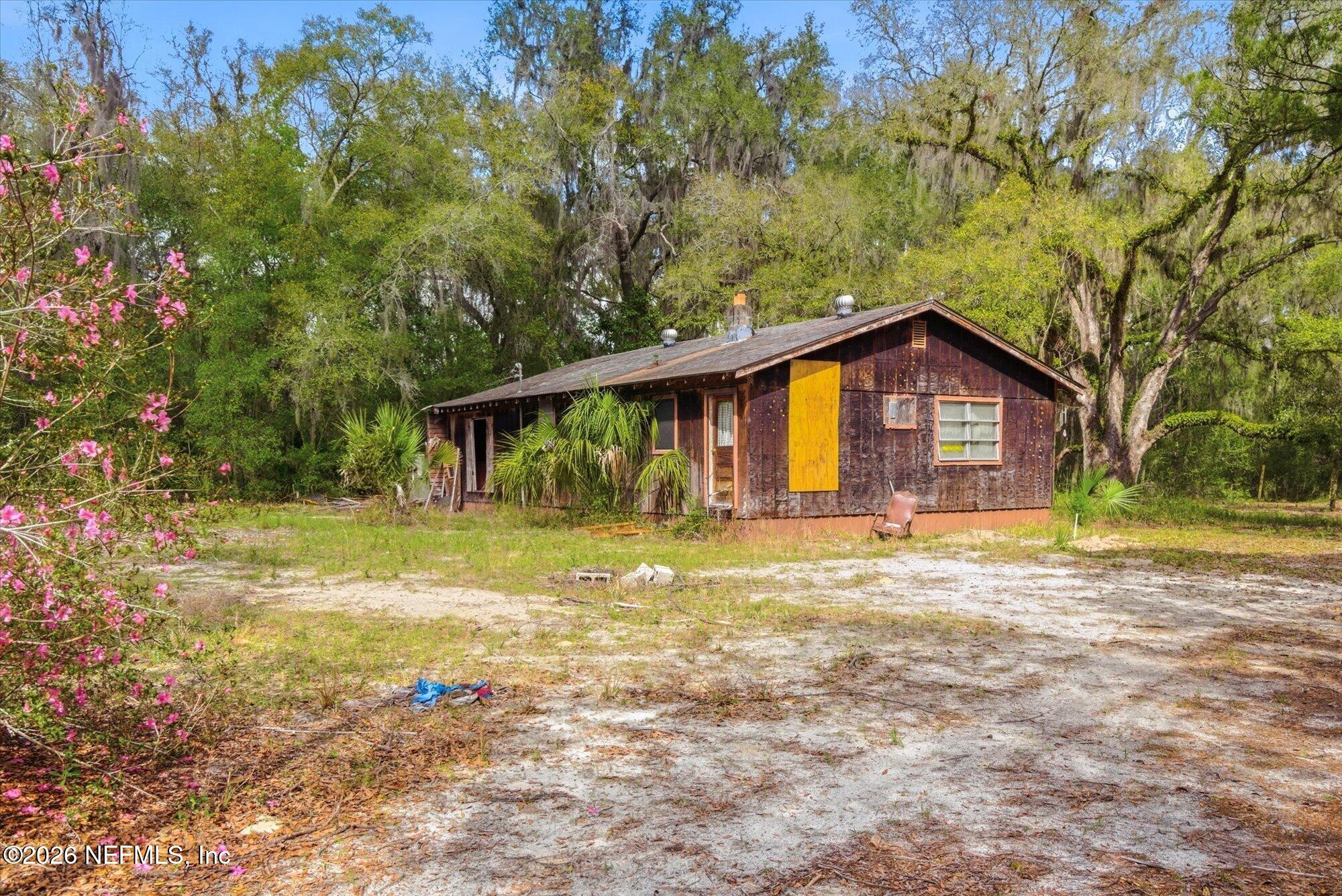 660 Old Welaka Road Satsuma, FL 32189 - Photo 5 of 28 a view of a house with pool and a yard