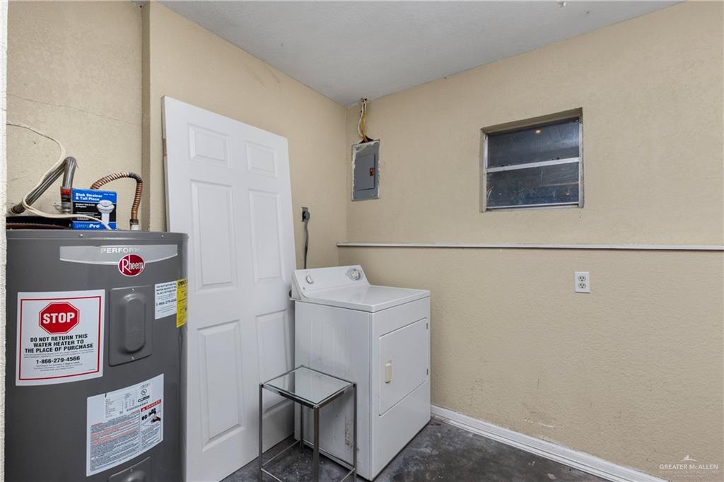 118 J R Becerra Avenue Progreso, TX 78596 - Photo 13 of 17 a utility room with dryer and washer