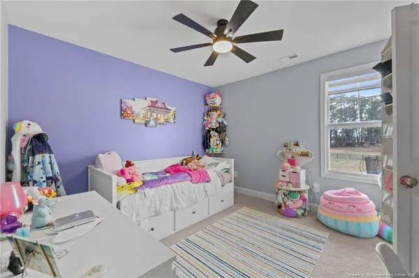 a bedroom with furniture and a bed