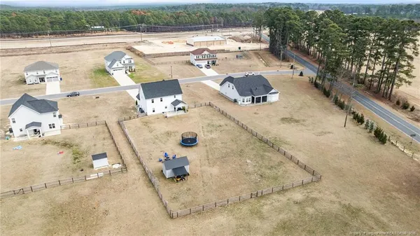 an aerial view of a house with outdoor space
