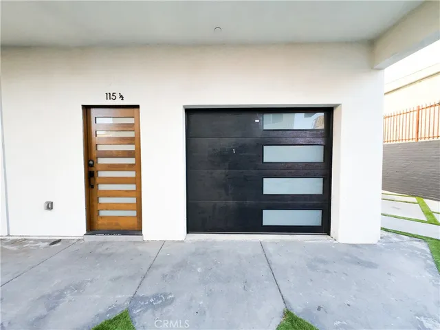 a view of an empty room with a dresser