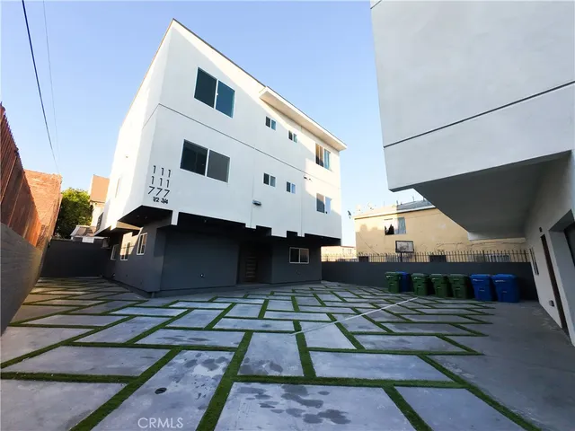 a front view of a building with many windows