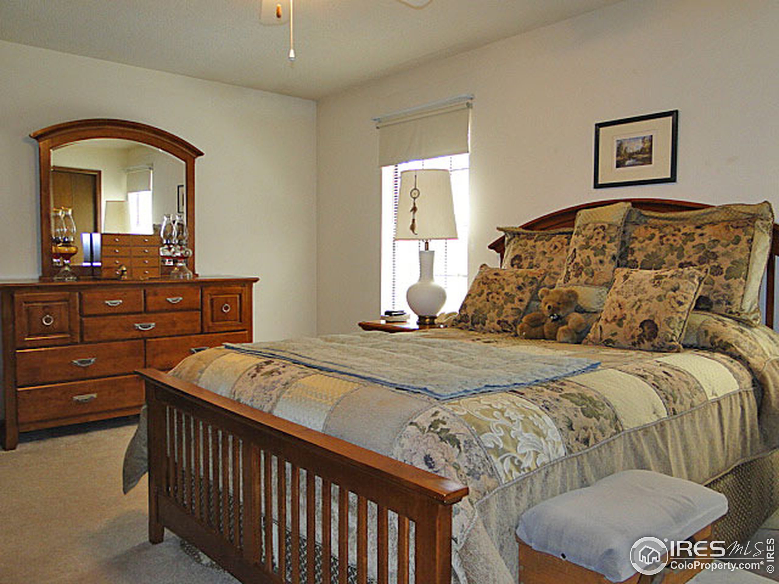 3334 34th Street Greeley, CO 80634 - Photo 11 of 25 a bedroom with a bed and a dresser