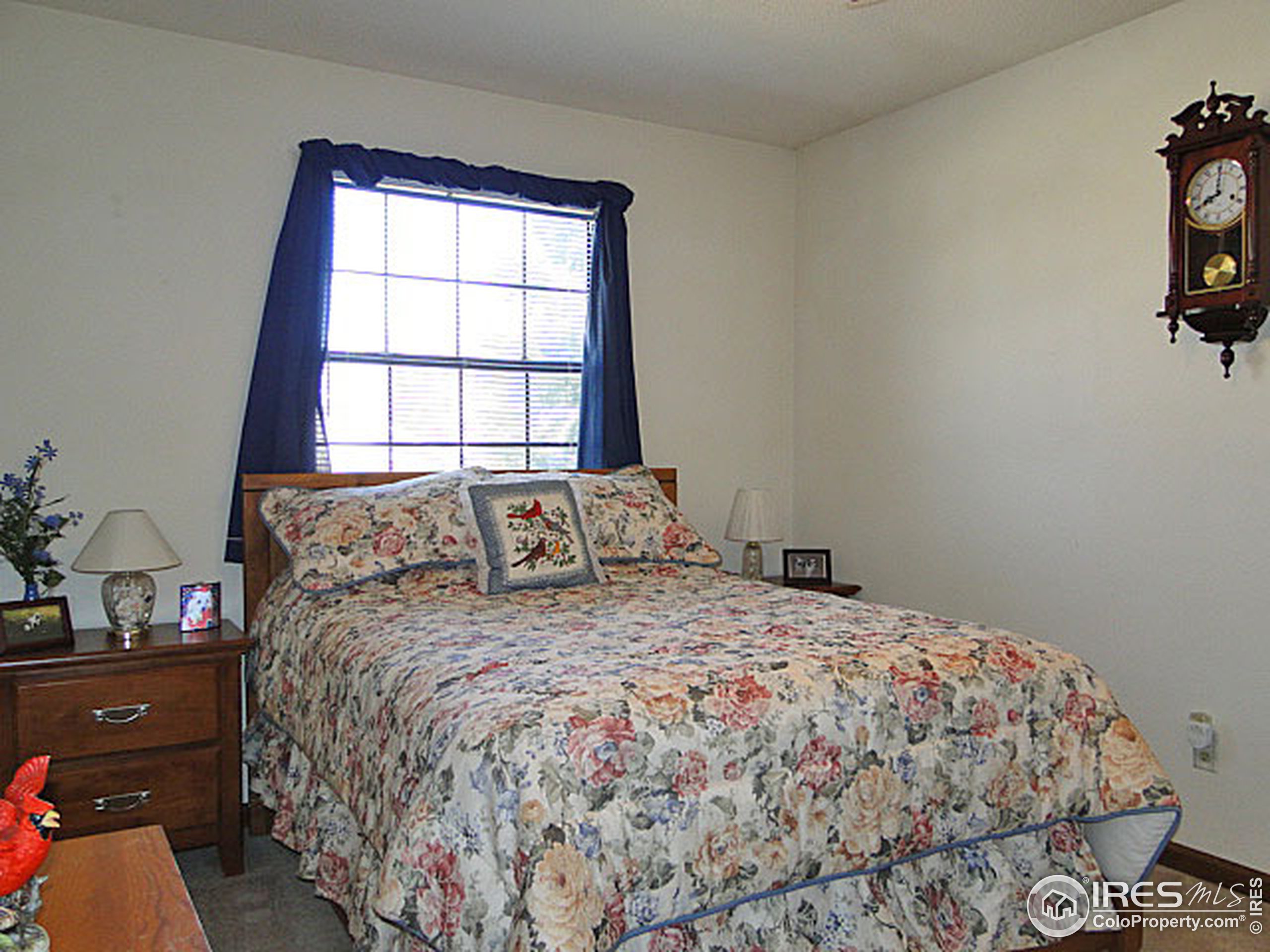 3334 34th Street Greeley, CO 80634 - Photo 13 of 25 a bedroom with a bed and a window