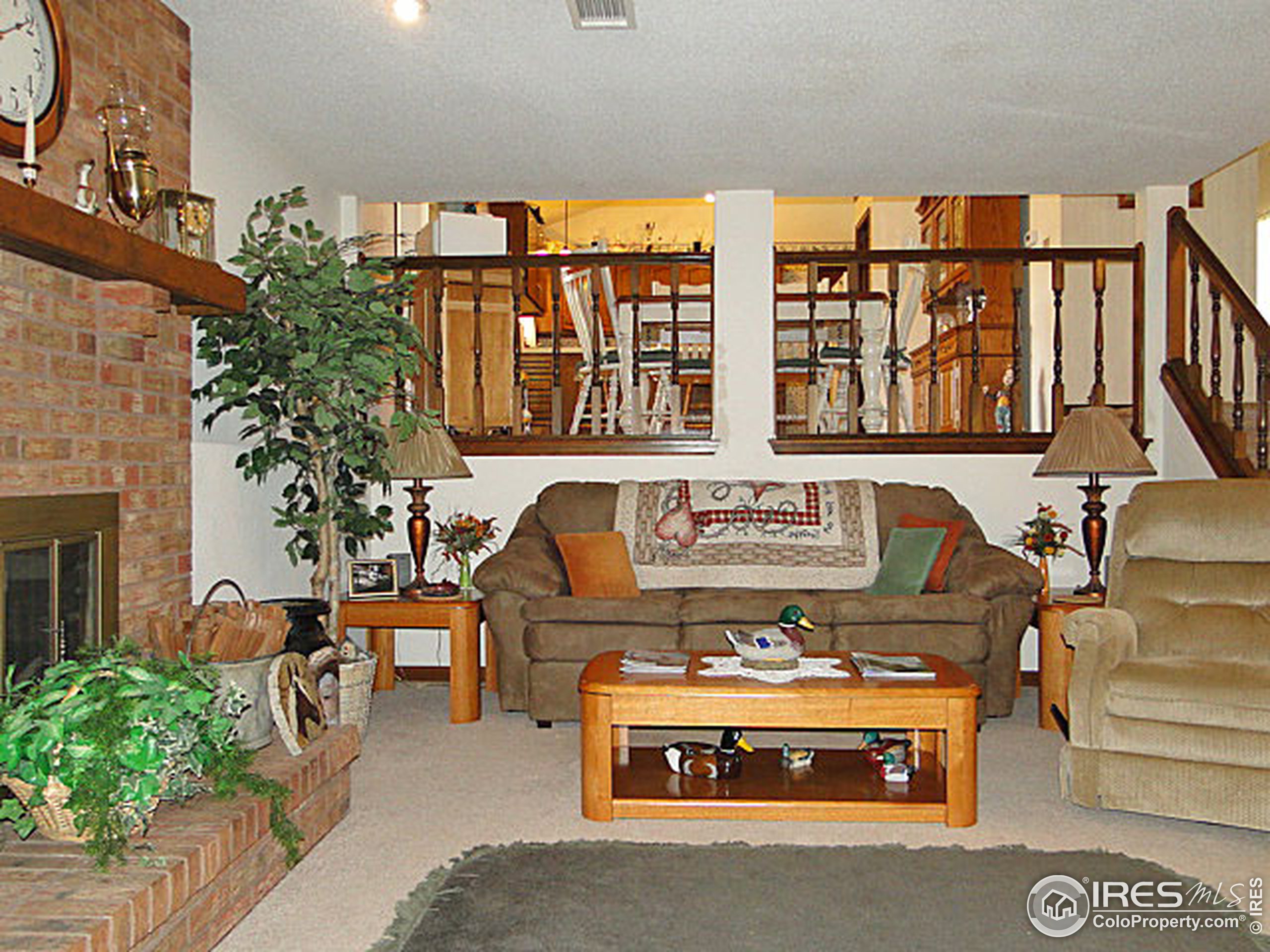 3334 34th Street Greeley, CO 80634 - Photo 17 of 25 a roof deck with couches and potted plants