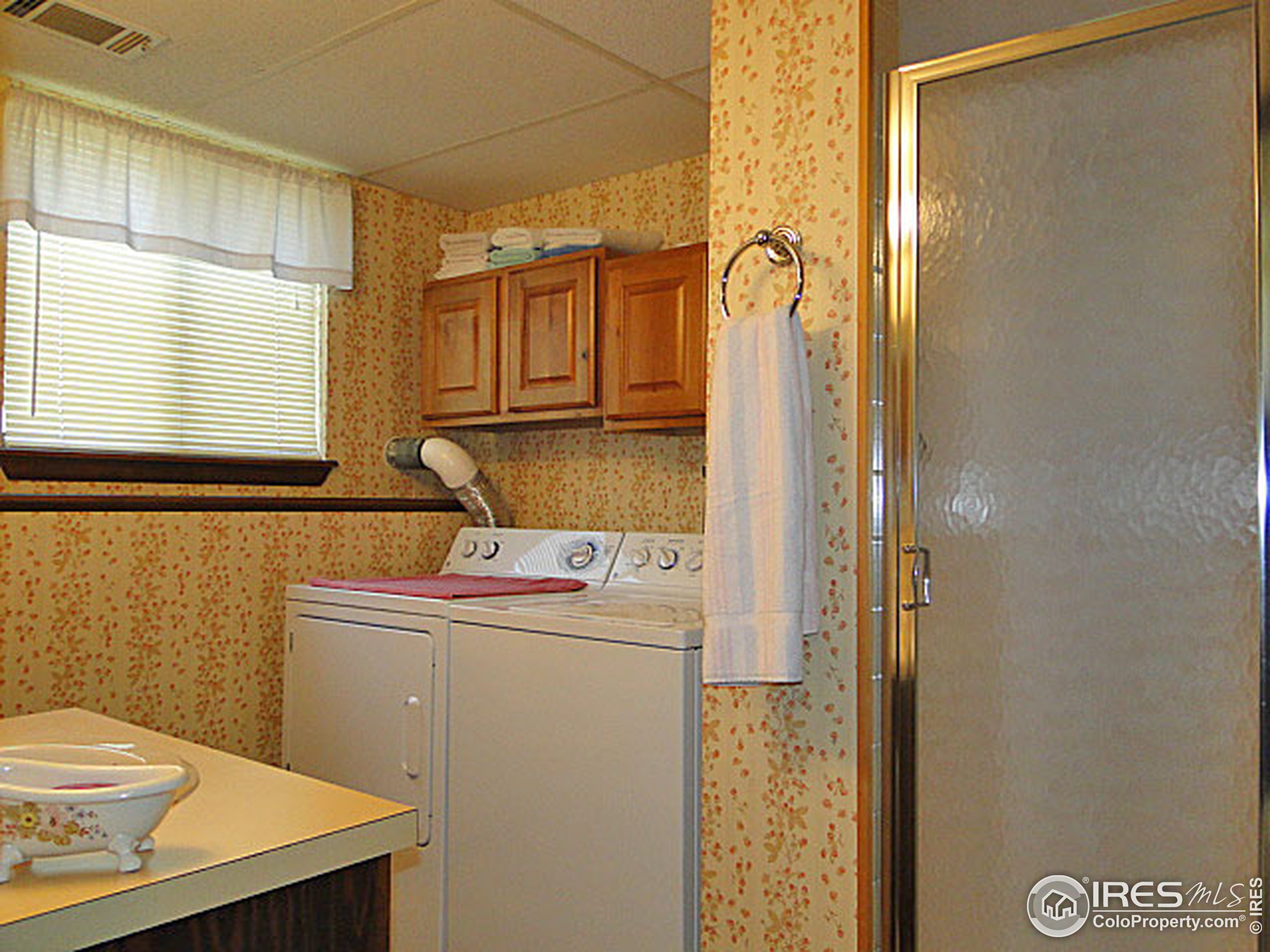 3334 34th Street Greeley, CO 80634 - Photo 20 of 25 a bathroom with a sink toilet and shower