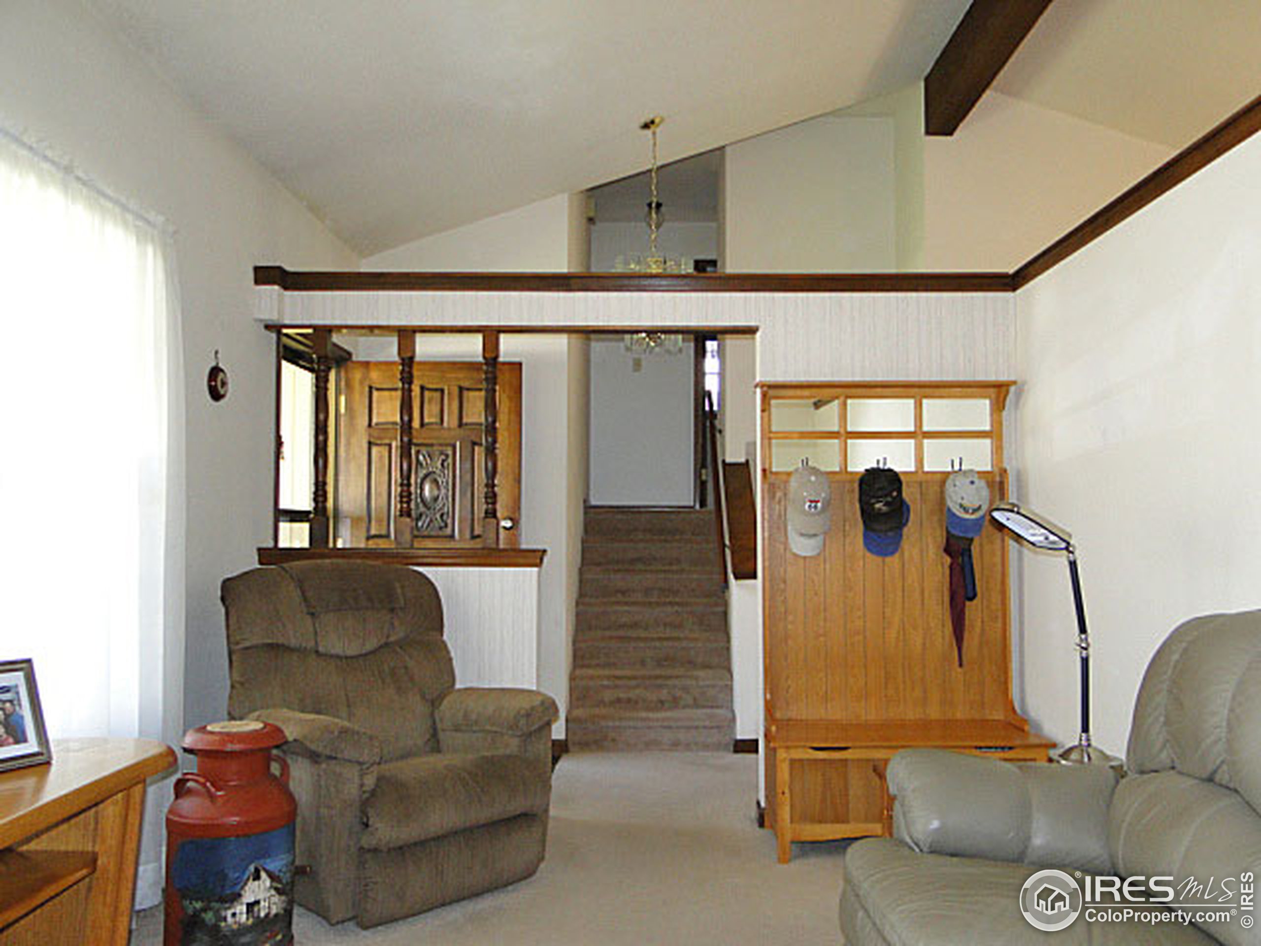 3334 34th Street Greeley, CO 80634 - Photo 2 of 25 a living room with furniture and a window