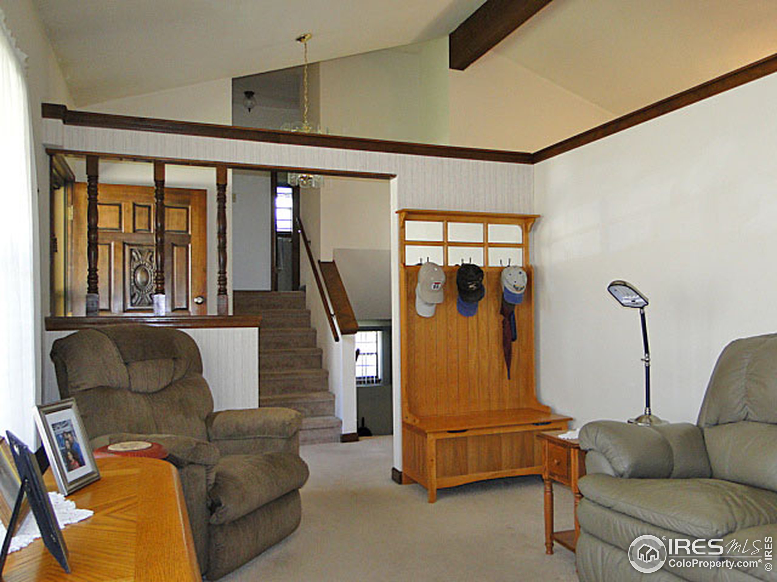 3334 34th Street Greeley, CO 80634 - Photo 6 of 25 a living room with furniture and a floor to ceiling window