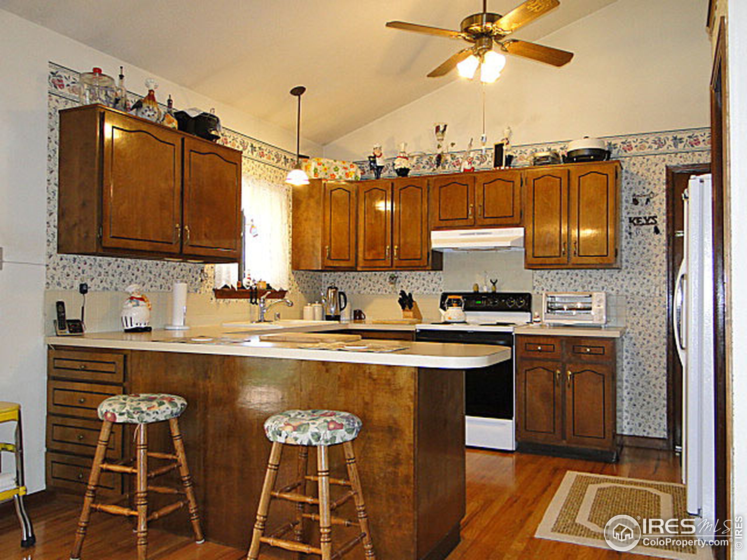 3334 34th Street Greeley, CO 80634 - Photo 7 of 25 a kitchen with stainless steel appliances a sink and cabinets
